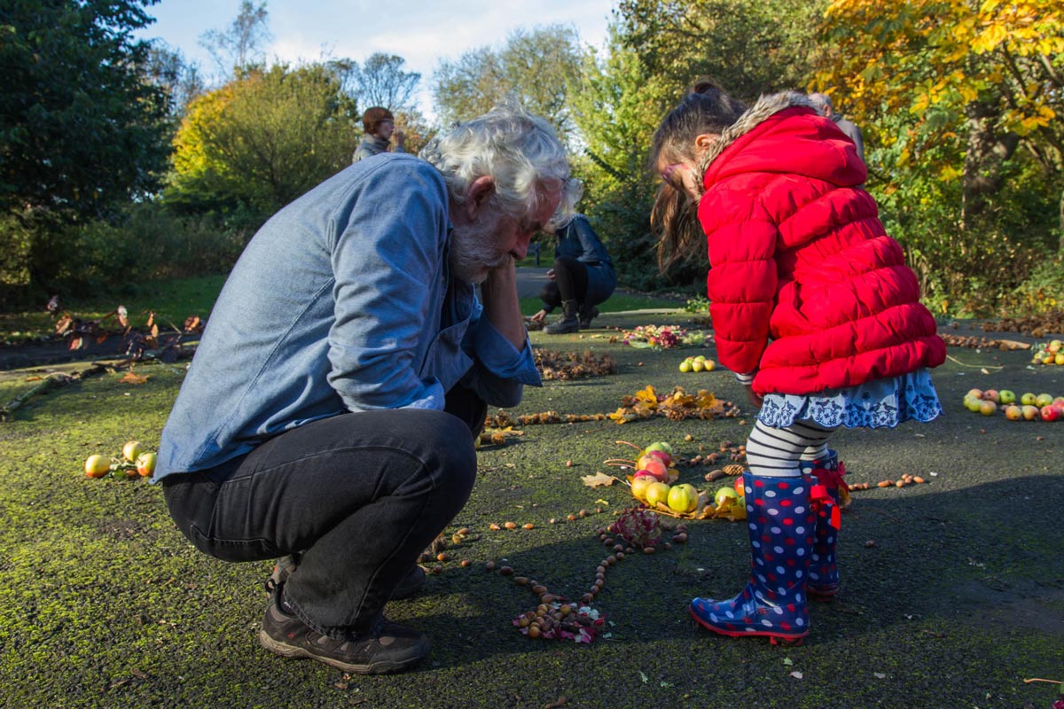 A grandad creating part of the installation with his grandchild.